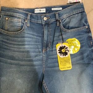 Black daisy high-rise jeans.